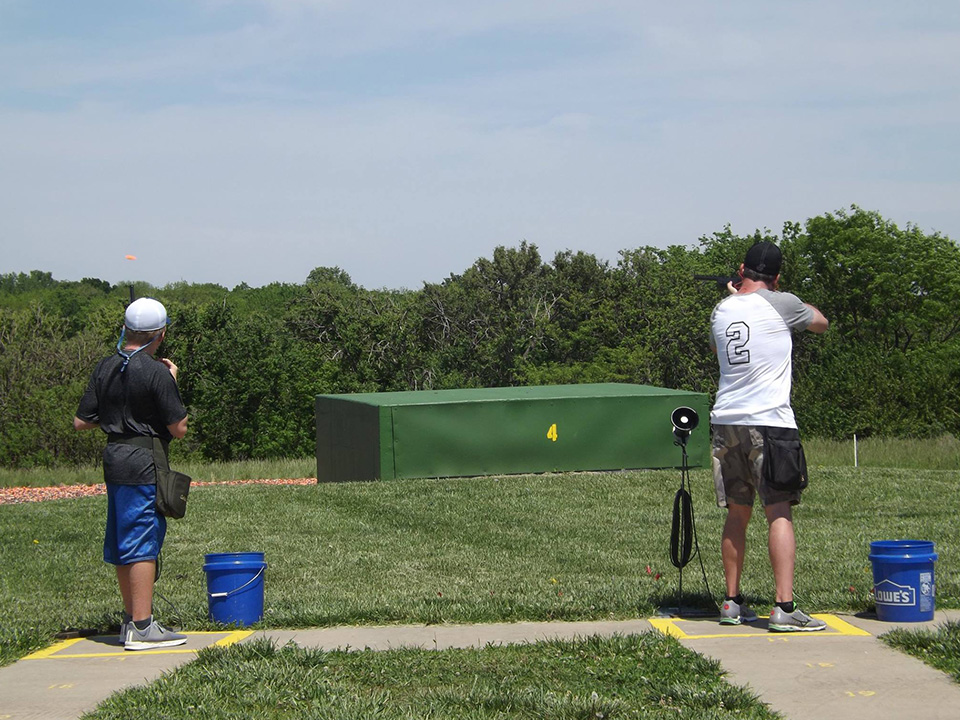 Man Firing a Shotgun